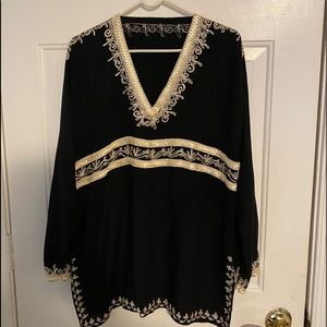 Women’s black/gold v neck blouse.
